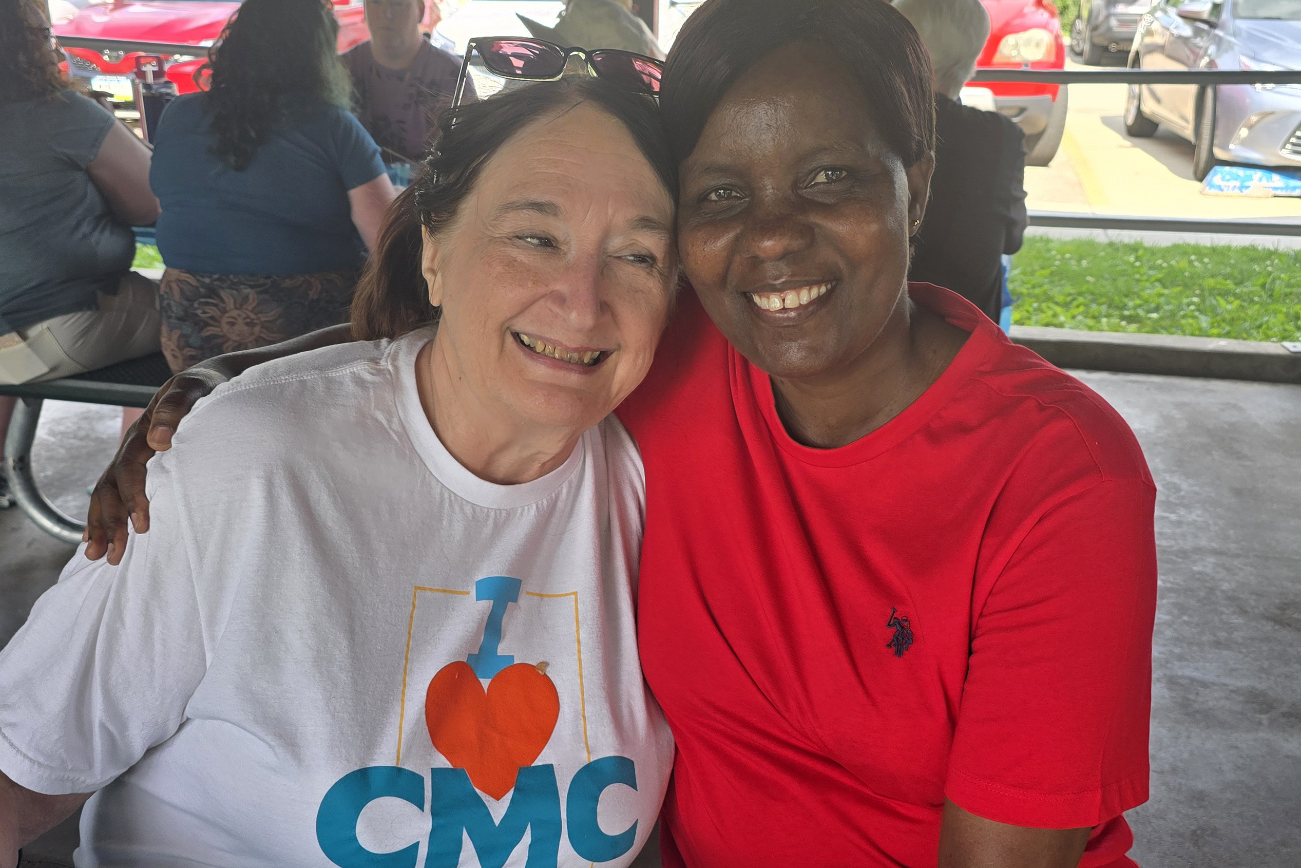 Linda with former student at picnic